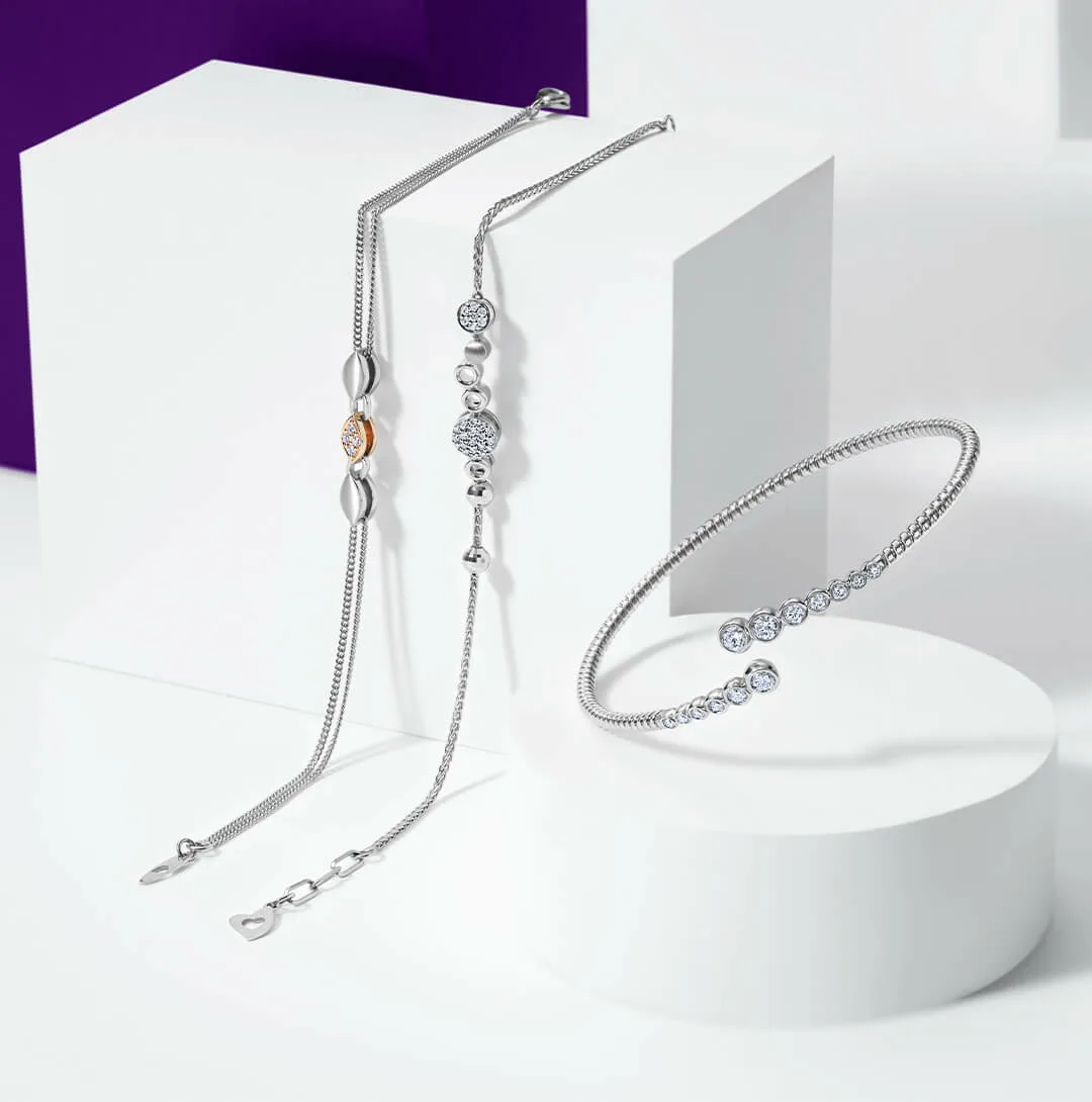 1/10ctw Diamond Twist Sterling Silver Bangle Bracelet | REEDS Jewelers